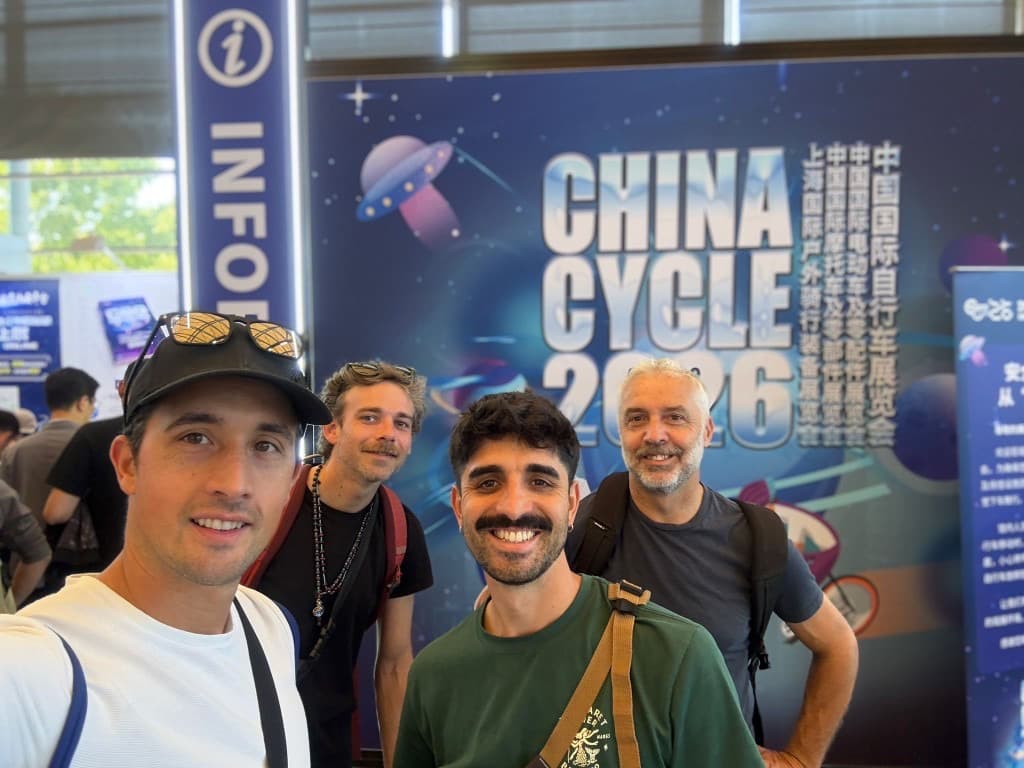 Group selfie at the China Cycle 2026 backdrop