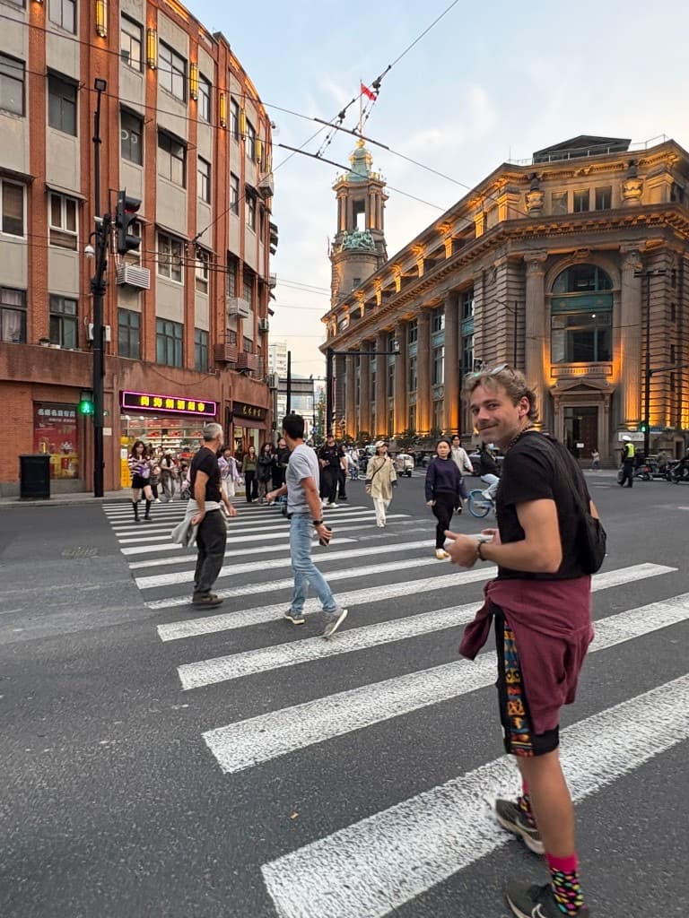 Crossing a Shanghai street at dusk during the China Cycle trip